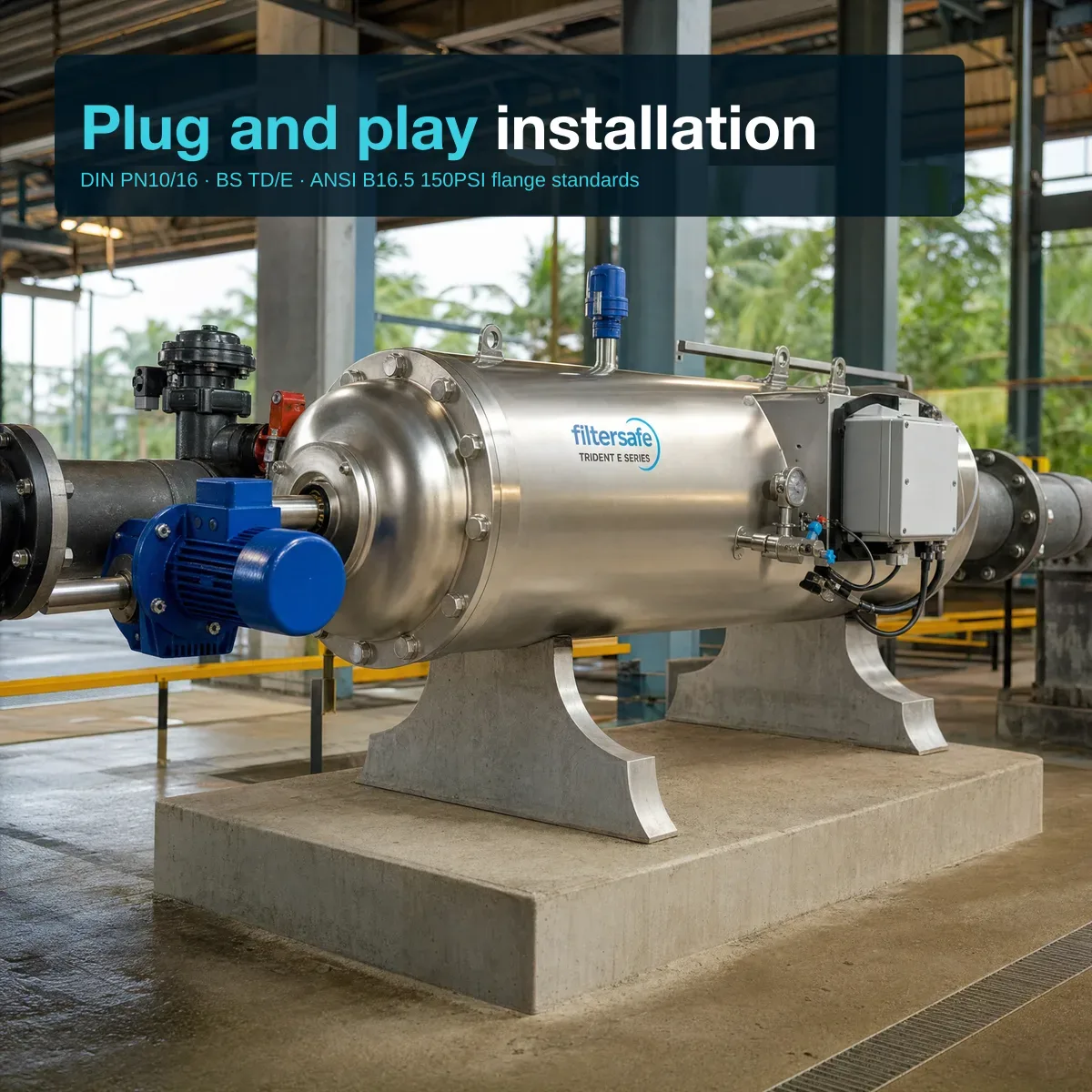 Wide-angle industrial installation view showing a single Filtersafe Trident E TRE0096 unit on a concrete equipment pad in a Malaysian or Singaporean industrial facility — polished SS horizontal body on saddle supports, blue gearmotor at one end, connected to flanged carbon-steel supply pipes; painted steel structural columns and overhead industrial lighting in background; editorial overlay top-left reads 'Plug and play installation' and 'DIN PN10/16 · BS TD/E · ANSI B16.5 150PSI flange standards'.