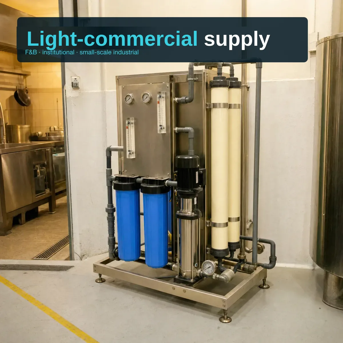 Compact commercial RO system installed in a Singapore or Malaysian light-commercial facility — stainless skid with pre-filter housings, membrane element housings, booster pump and gauges in a modest ASEAN commercial interior.